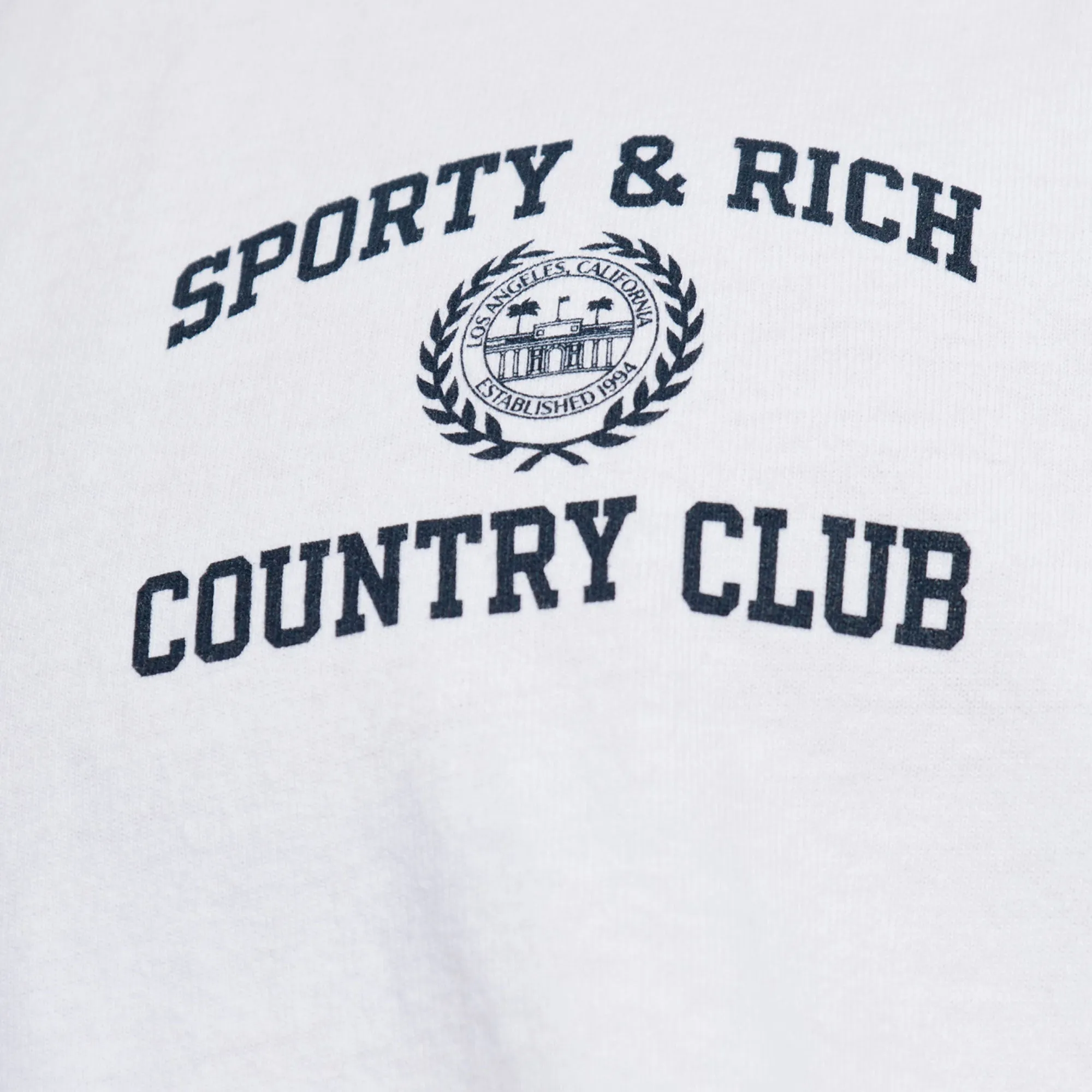 SPORTY & RICH | WMN'S VARSITY CREST T-SHIRT { WHITE/NAVY